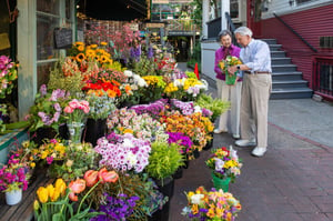 Senior couple picking out a bouquet of flowers at the flower market