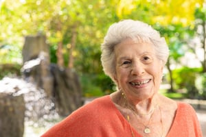 Senior woman smiling outdoors