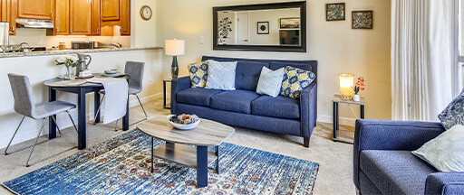 Living room and kitchen of an apartment at Piedmont Gardens