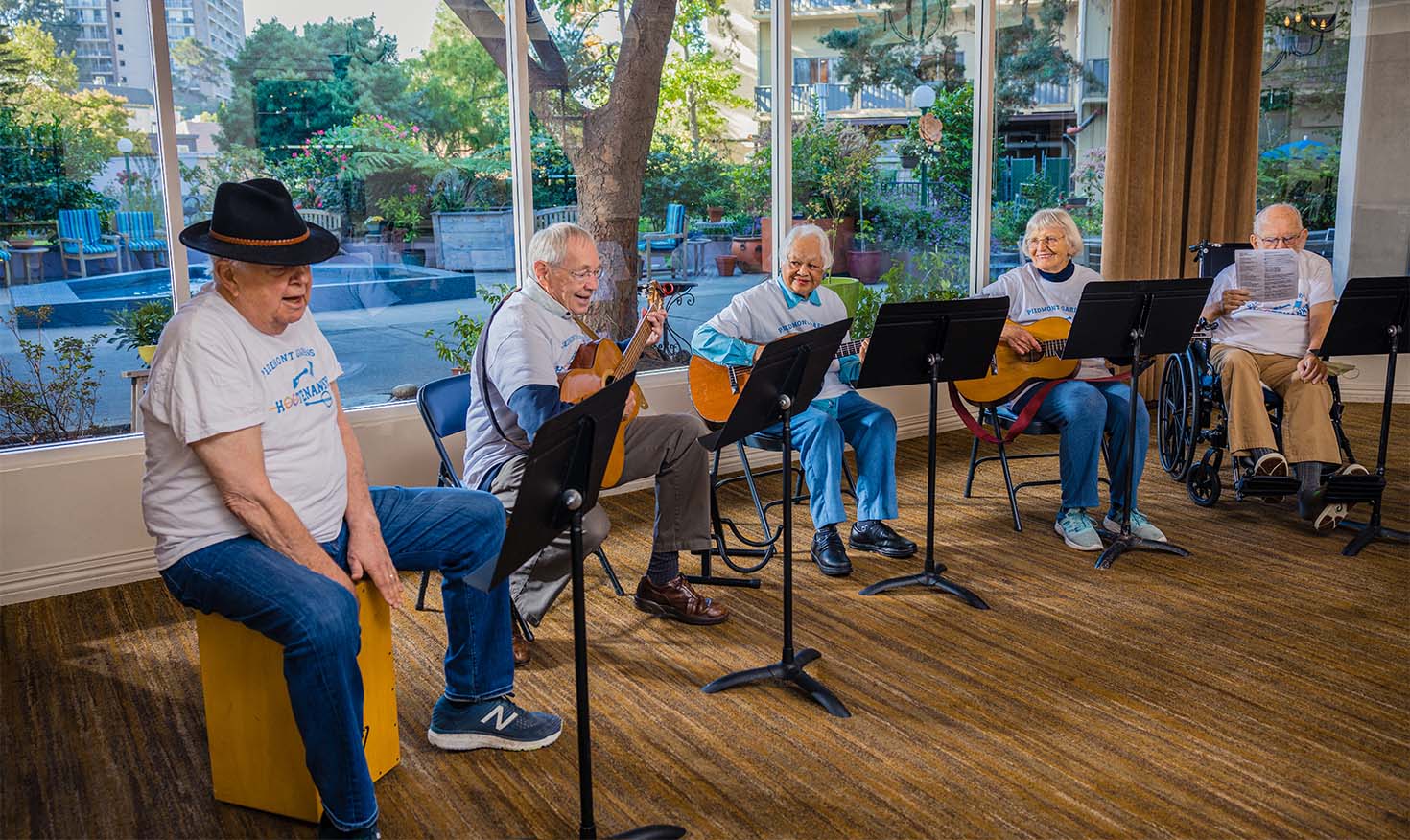 Group of seniors playing guitar and singing