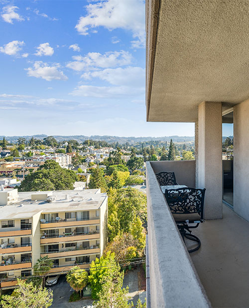 Outdoor patio on high-rise apartment building at Piedmont Gardens with city views