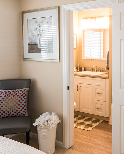 View of a bathroom from the bedroom of an assisted living apartment at Redwood Terrace