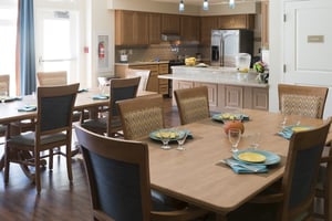 Memory support kitchen and family dining area at Redwood Terrace