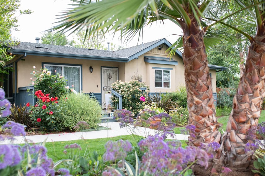 exterior of homes with sidewalks and gardens