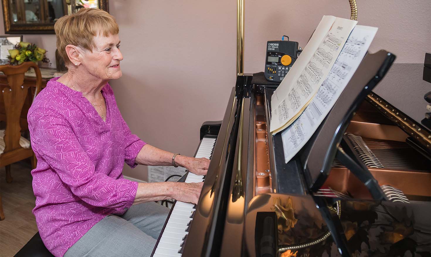 Senior woman playing the piano