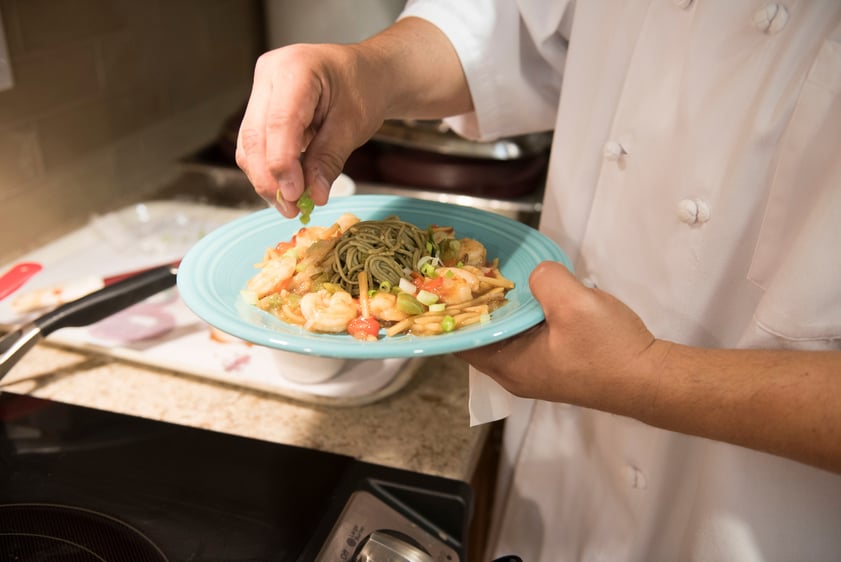 chef holding a plate