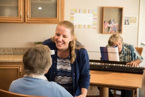 woman talking to a senior resident