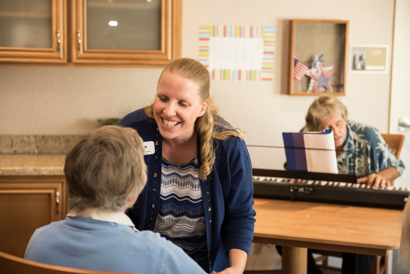 woman talking to a senior resident