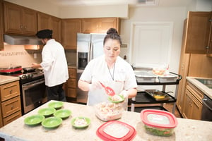 two workers preparing meal