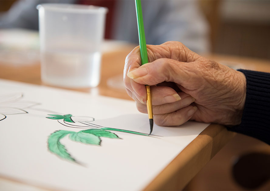 Close-up of someone holding a paintbrush