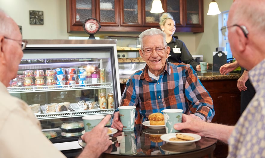 Three senior men having breakfast at a cafe in Rosewood