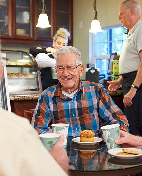 Senior man having breakfast at a cafe in Rosewood