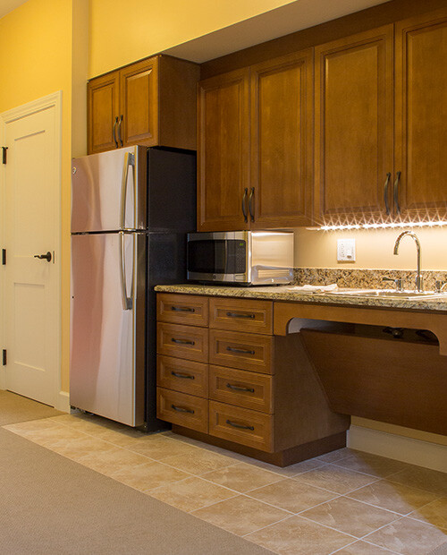 Kitchenette with fridge and microwave in an apartment a The Terraces at Los Altos