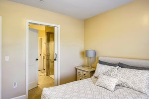 Bedroom and bathroom of an apartment at The Terraces at Los Altos