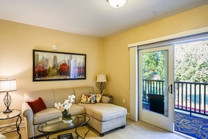 Living room with a balcony of an apartment at The Terraces at Los Altos