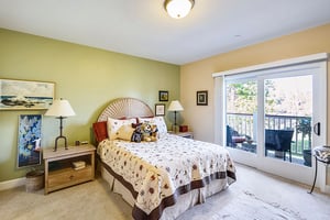 Large bedroom with balcony of an apartment at The Terraces at Los Altos