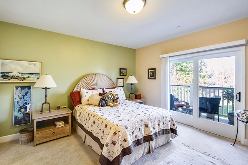 Large bedroom with balcony of an apartment at The Terraces at Los Altos