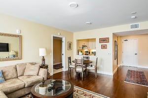 Living room with view of the kitchen of an apartment at The Terraces at Los Altos