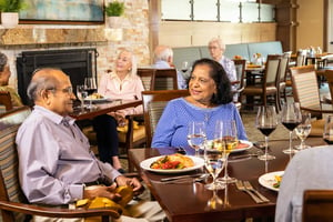 Seniors eating dinner in The Terraces of Los Altos fine dining venue