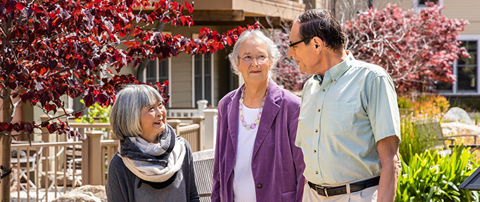 senior friends chatting outside