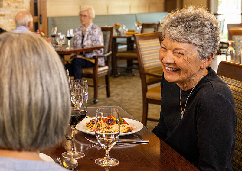 Senior women eating in The Terraces at Los Altos dining venue