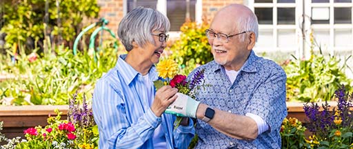 Senior woman and senior man in the garden at The Terraces at Summitview