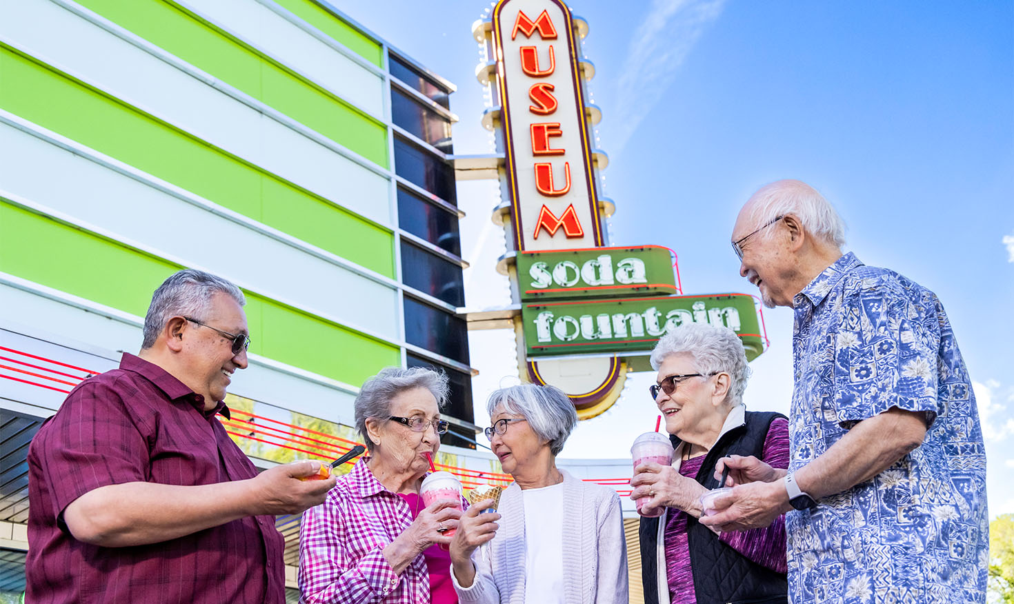 Group of five seniors enjoying milkshakes and ice cream outside the Yakima Valley Museum Soda Fountain