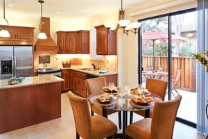 Kitchen and dining area with sliding glass doors leading to a patio of a home at Valle Verde