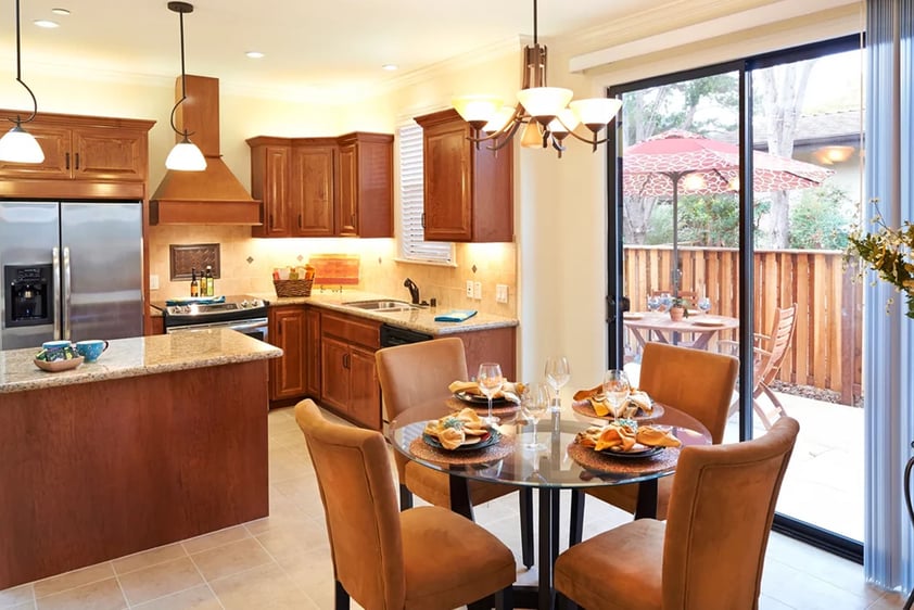 Kitchen and dining area with sliding glass doors leading to a patio of a home at Valle Verde