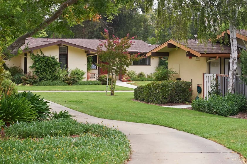 Walking path beside homes on the Valle Verde campus