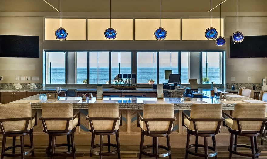 The Ocean Bar at White Sands La Jolla with views of the ocean outside the windows