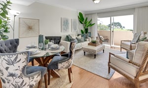 Living room and dining area of an apartment at White Sands La Jolla