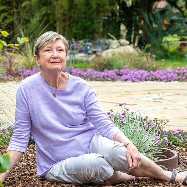 Senior woman sitting in the garden at Westminster Gardens