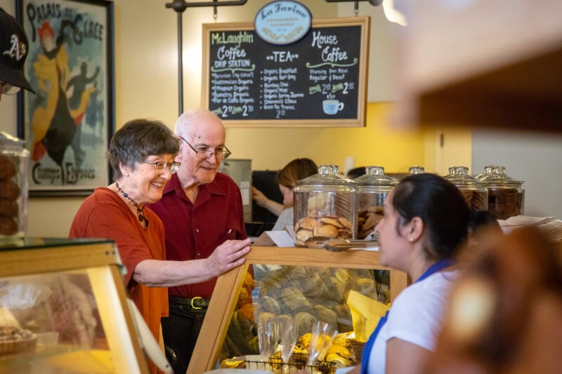 Senior couple at the counter in a coffee shop