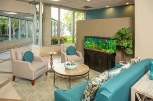 Common seating area with fish tank at Piedmont Gardens