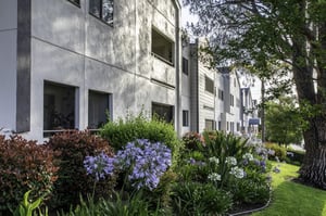 Side view of the exterior of an apartment building at Redwood Terrace