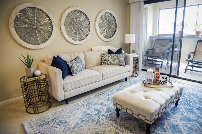 Furnished living room with sliding glass doors leading to a balcony of an apartment at Redwood Terrace