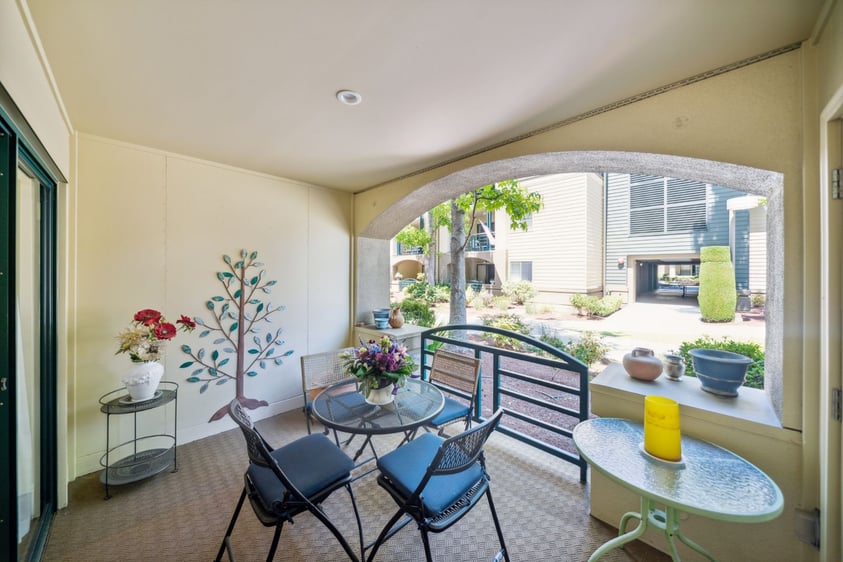 Covered patio with outdoor furniture at an apartment at The Terraces of Los Gatos