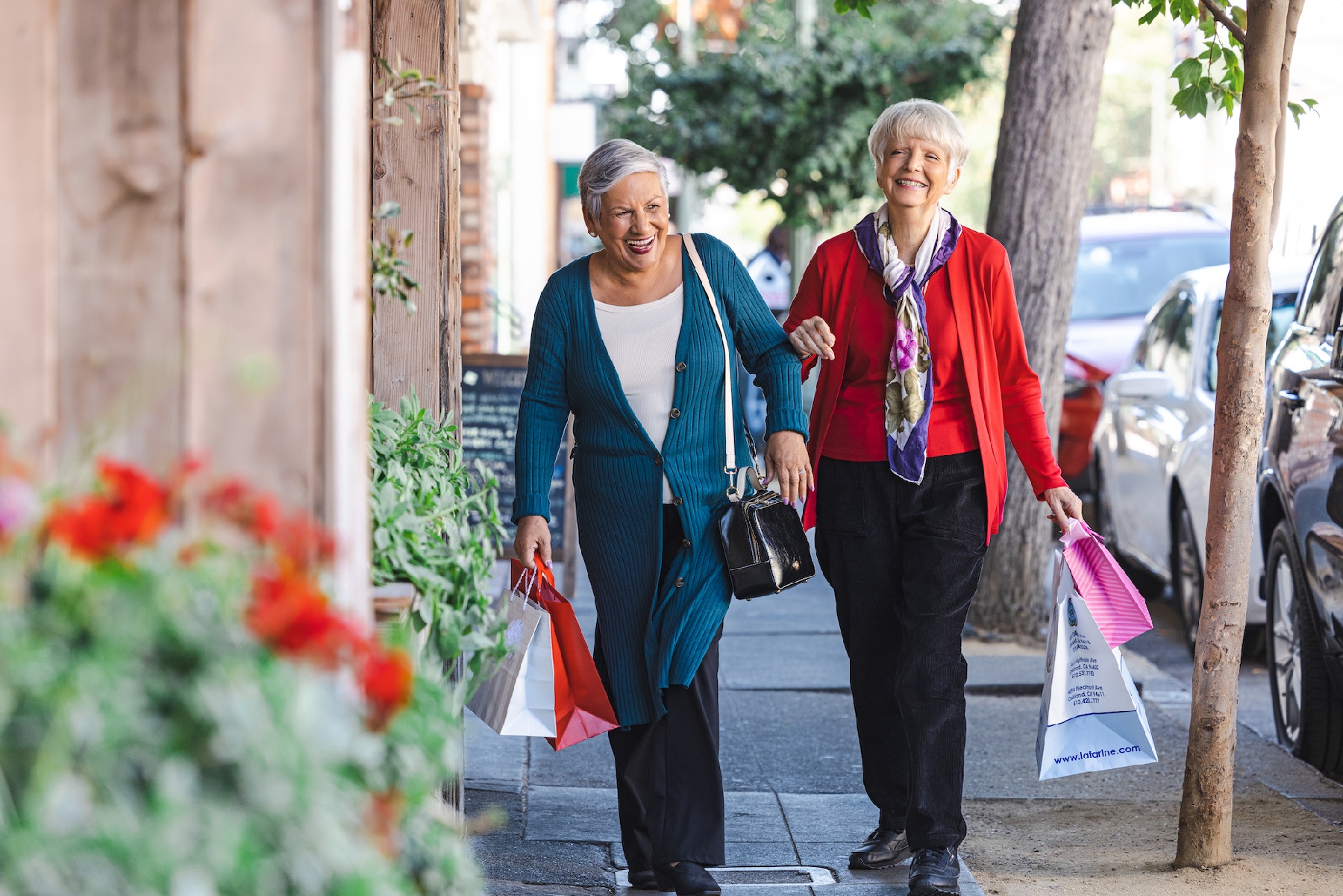 Two ladies walking together after shopping