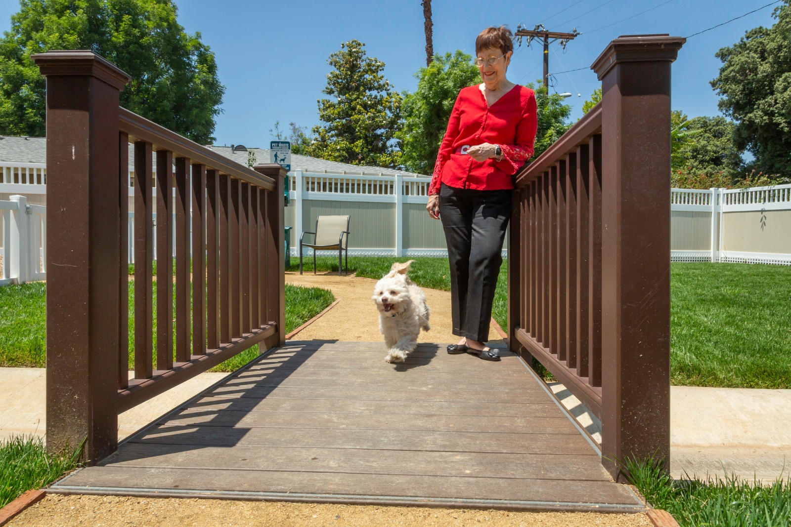 Woman wearing red blouse with her dog