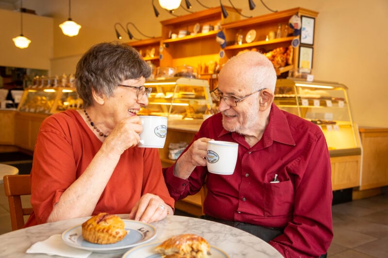 Senior couple drinking coffee at coffee shop