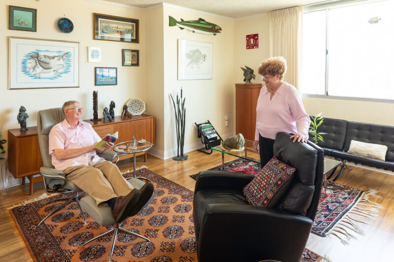 Senior couple in the living room of their apartment at Piedmont Gardens