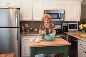 Senior lady baking in her kitchen