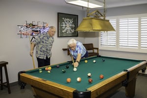 Two men playing a game of pool