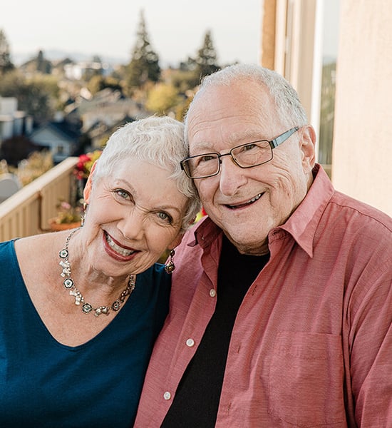 Sheila & Jerry smiling outside