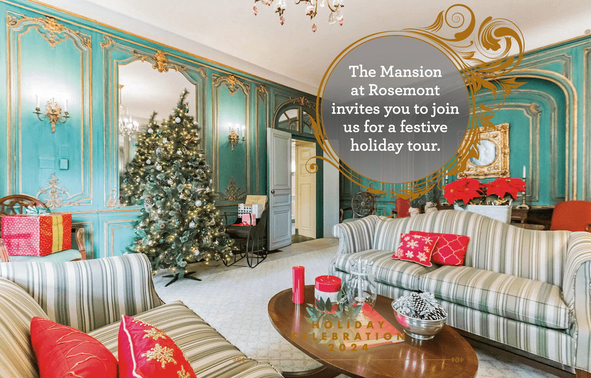 A luxurious room in The Mansion at Rosemont with festive decor, including a Christmas tree and elegant turquoise walls with gold details.