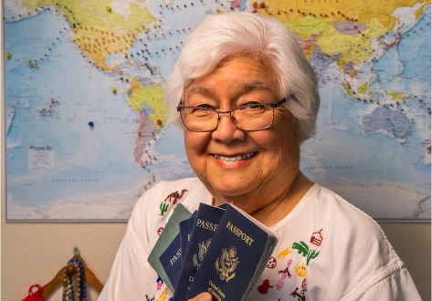 Janet holding up passports