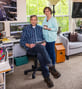 senior couple posing in home office