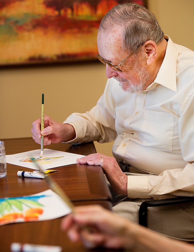 Senior man in a painting class