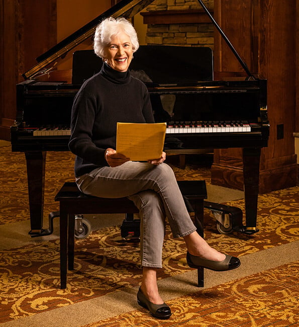 Ruby sitting at a piano